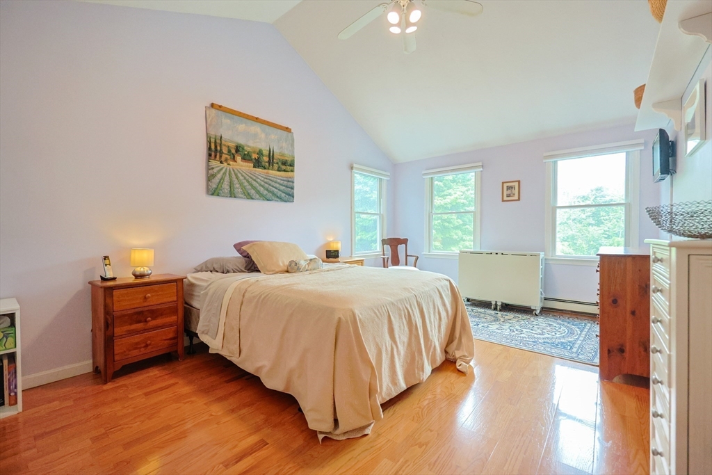 4 Rainbow Drive Medway, MA 02053 - Photo 21 of 42 a spacious bedroom with a bed and a large window