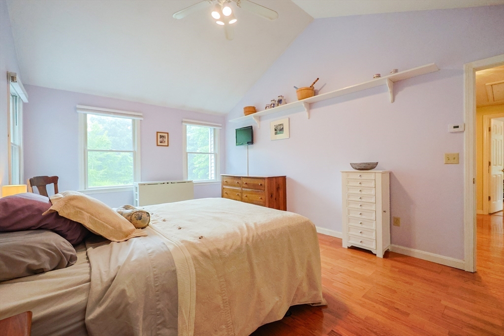 4 Rainbow Drive Medway, MA 02053 - Photo 22 of 42 a bedroom with a bed and wooden floor