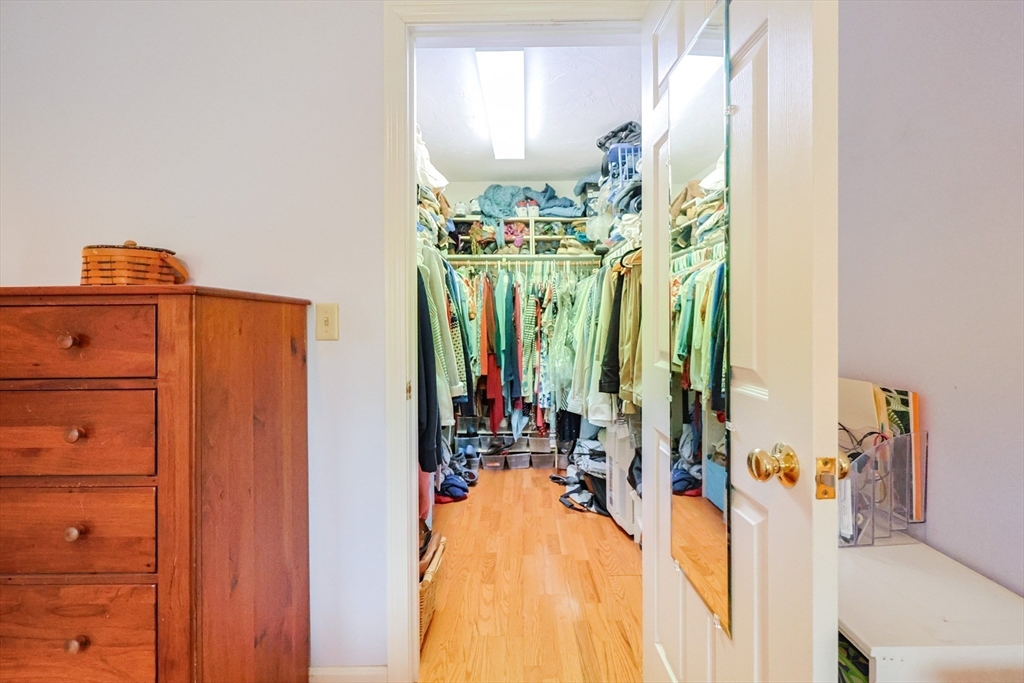 4 Rainbow Drive Medway, MA 02053 - Photo 25 of 42 a view of walk in closet with clothes and shoes