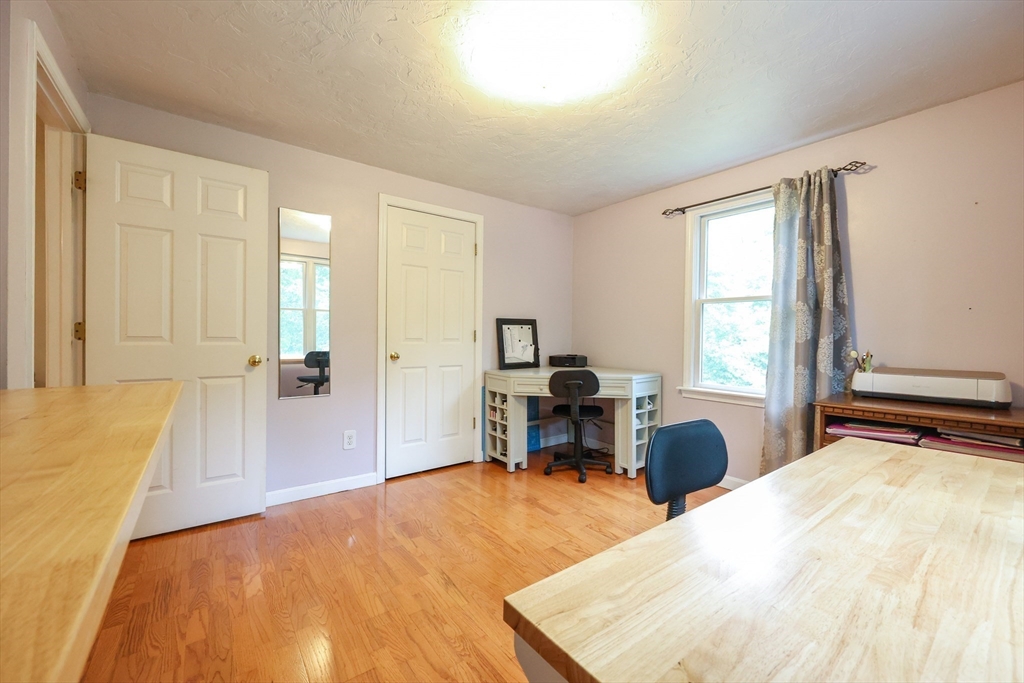 4 Rainbow Drive Medway, MA 02053 - Photo 30 of 42 a bedroom with a bed and wooden floor