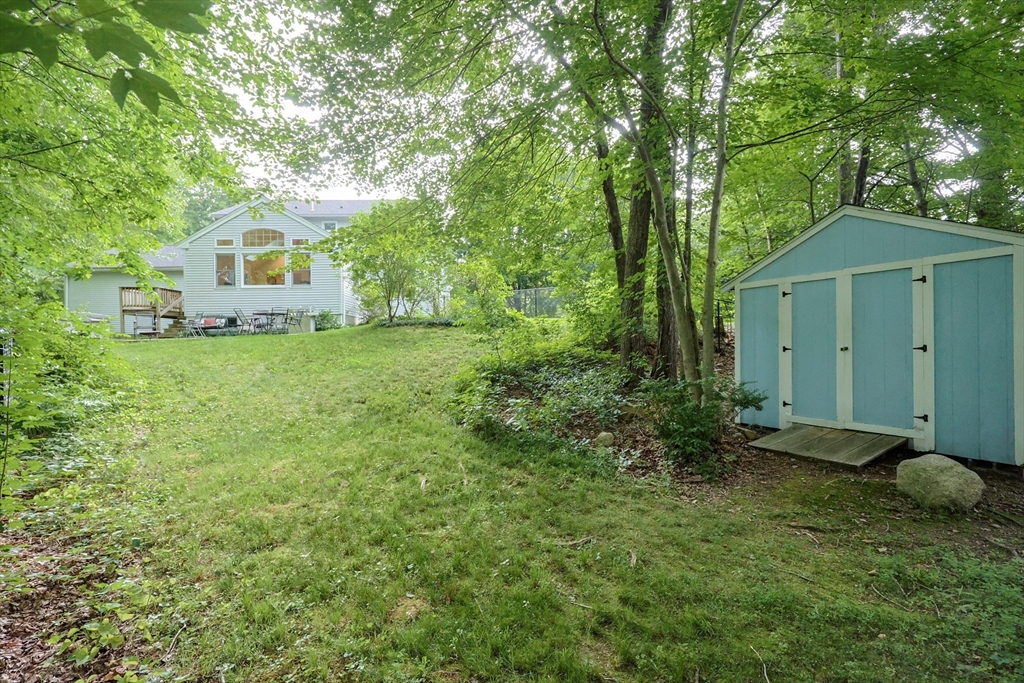 4 Rainbow Drive Medway, MA 02053 - Photo 4 of 42 a front view of a house with garden