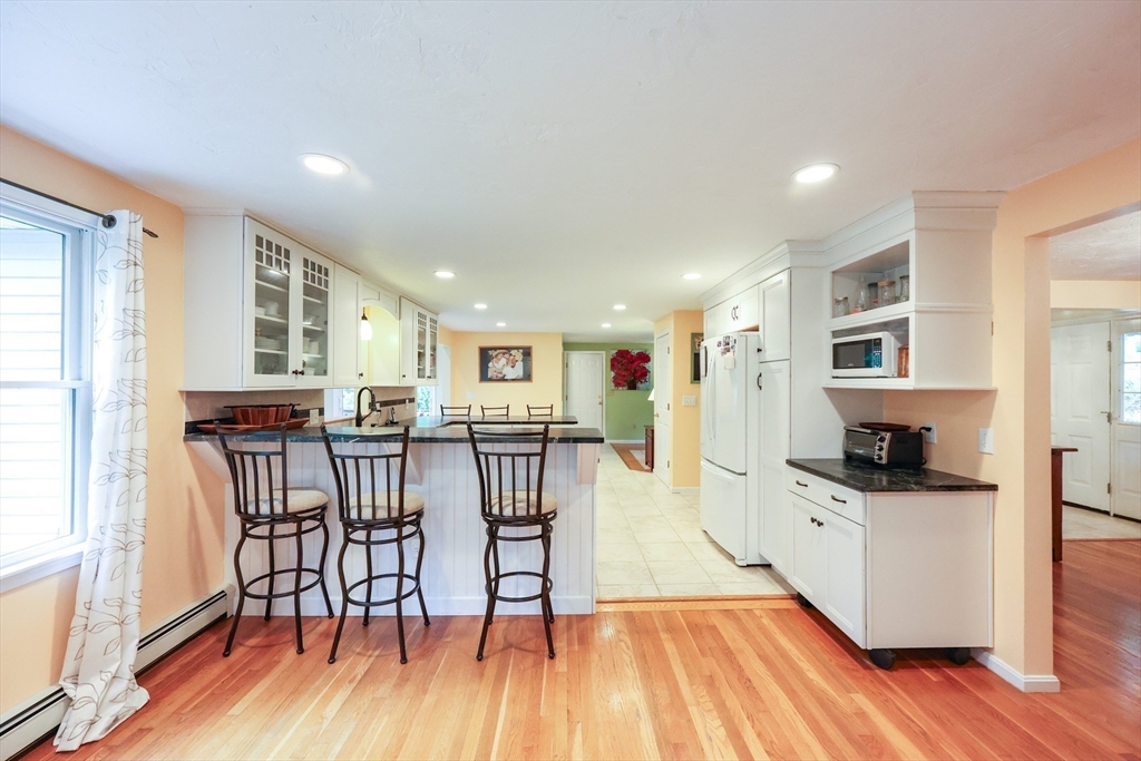 4 Rainbow Drive Medway, MA 02053 - Photo 7 of 42 a view of a dining room with furniture and wooden floor