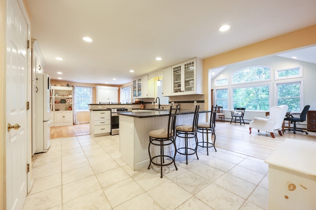 4 Rainbow Drive Medway, MA 02053 - Photo 8 of 42 a view of a dining area with furniture and a kitchen view