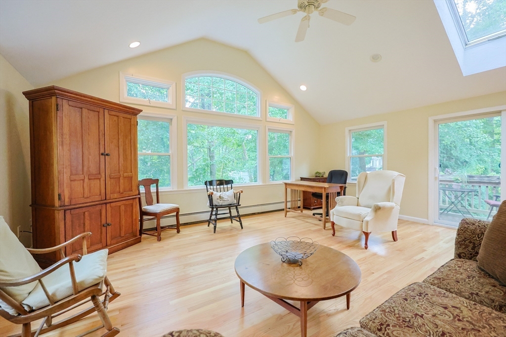 4 Rainbow Drive Medway, MA 02053 - Photo 9 of 42 a living room with furniture and a floor to ceiling window