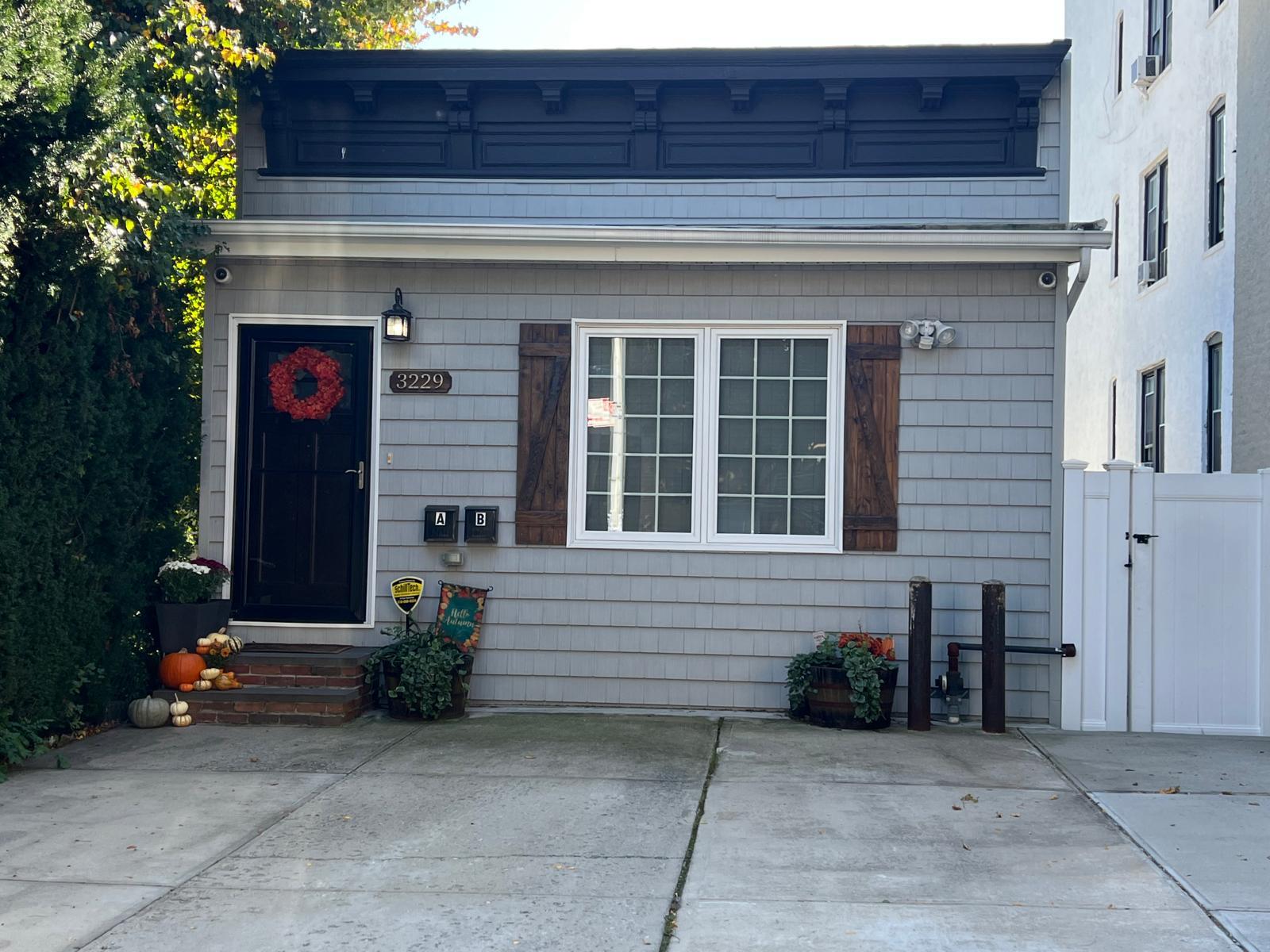 32-29 44th Street Queens, NY 11103 - Photo 1 of 1 a front view of a house with entryway