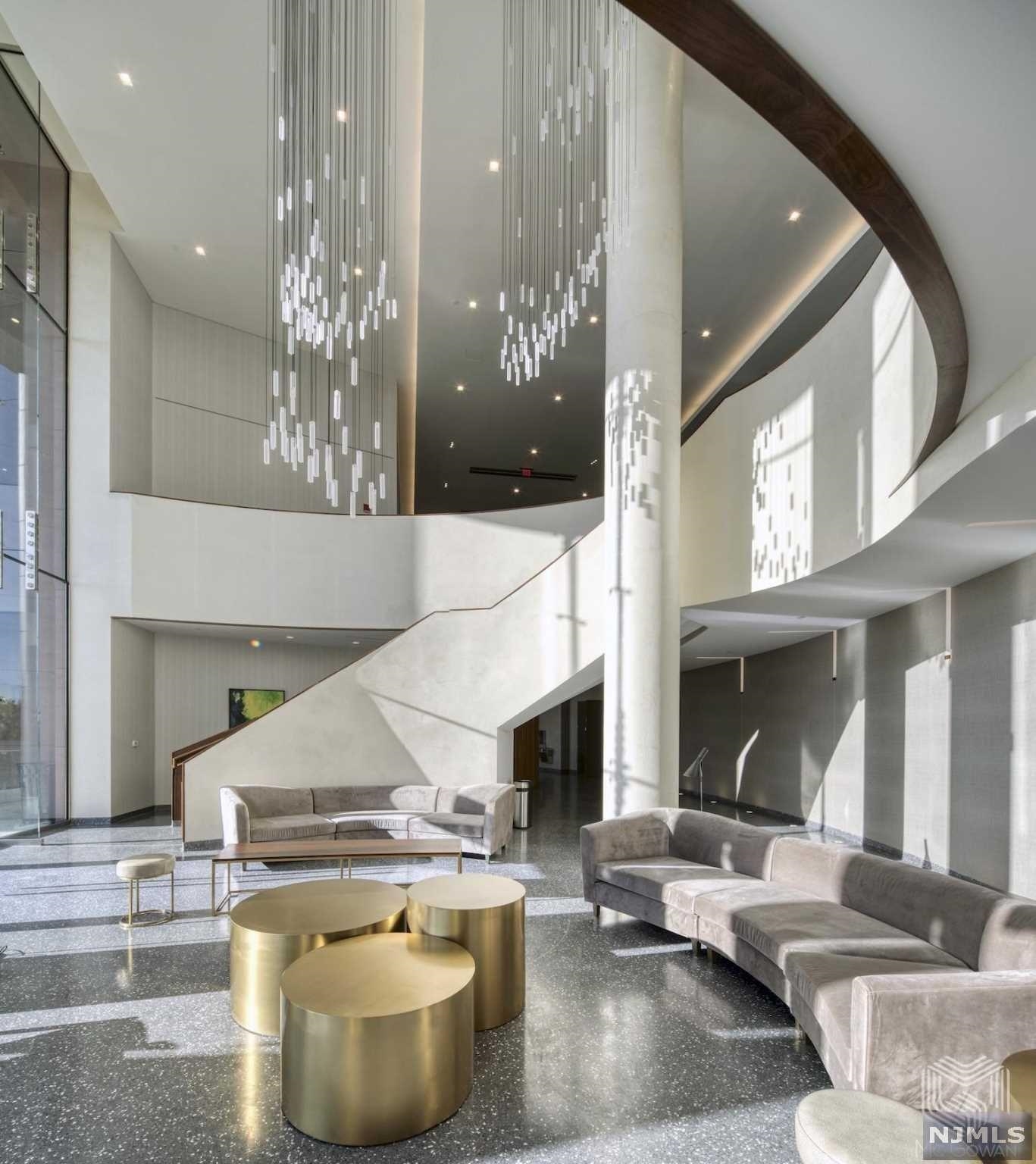 320 Adolphus Avenue, Unit 117 Cliffside Park, NJ 07010 - Photo 11 of 27 a living room with fireplace and furniture