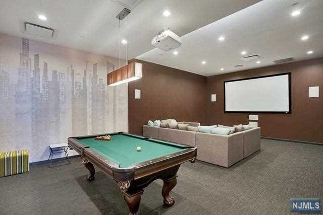 320 Adolphus Avenue, Unit 117 Cliffside Park, NJ 07010 - Photo 19 of 27 a living room with furniture and a pool table