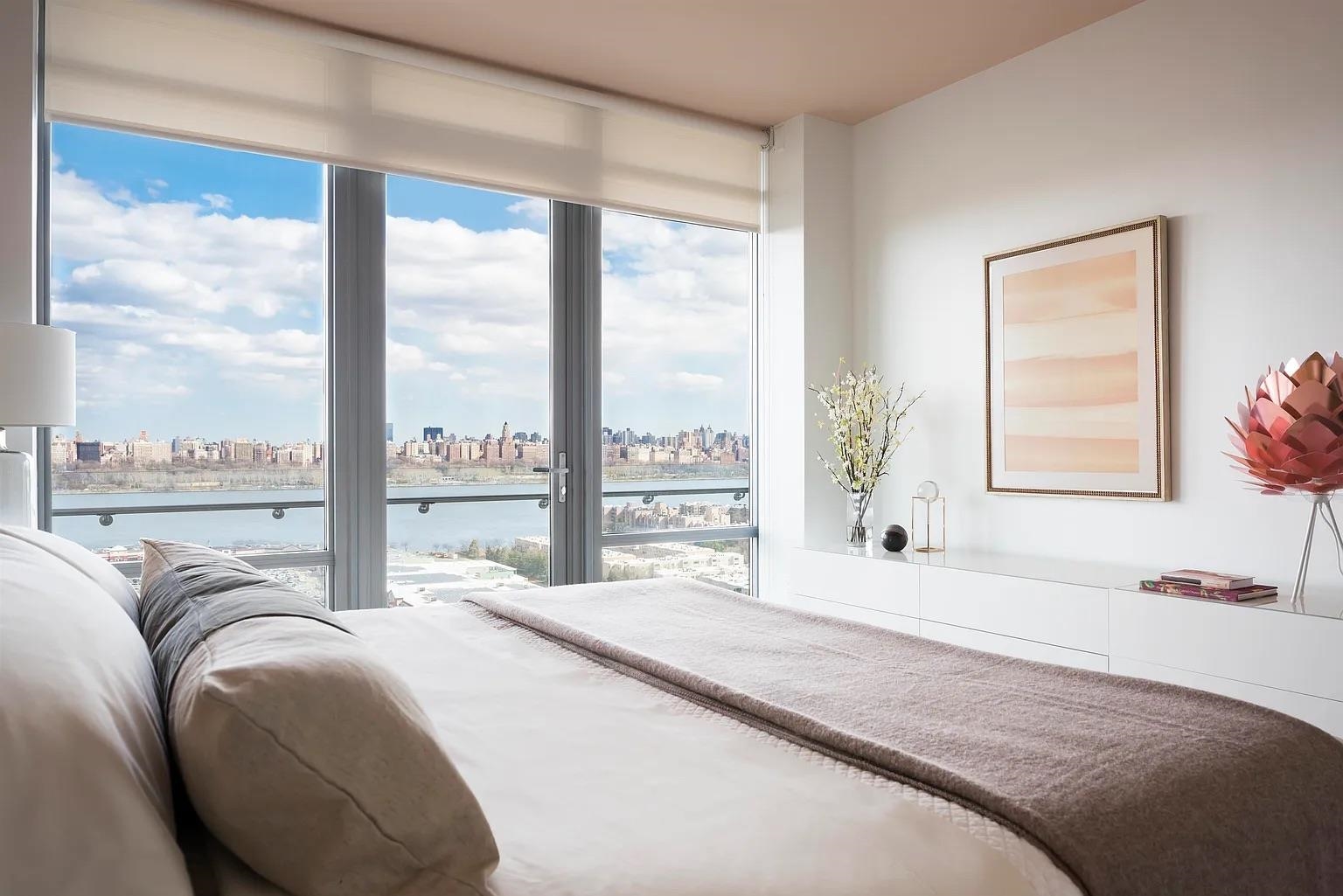 320 Adolphus Avenue, Unit 117 Cliffside Park, NJ 07010 - Photo 7 of 27 a bedroom with a large bed and a large window