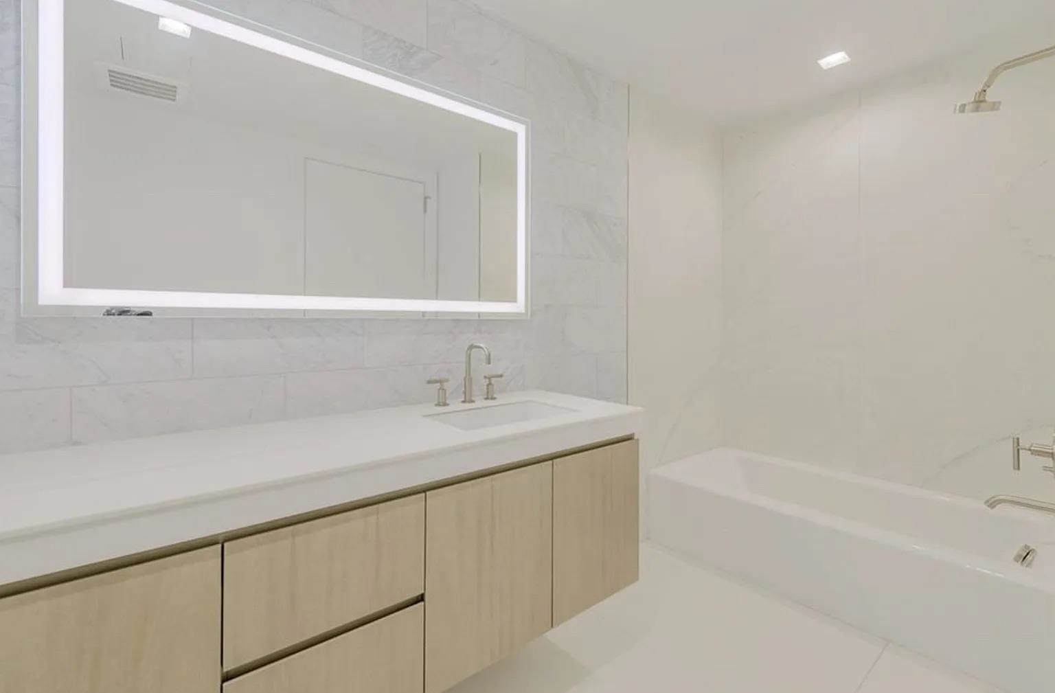320 Adolphus Avenue, Unit 117 Cliffside Park, NJ 07010 - Photo 8 of 27 a bathroom with a sink and a bathtub