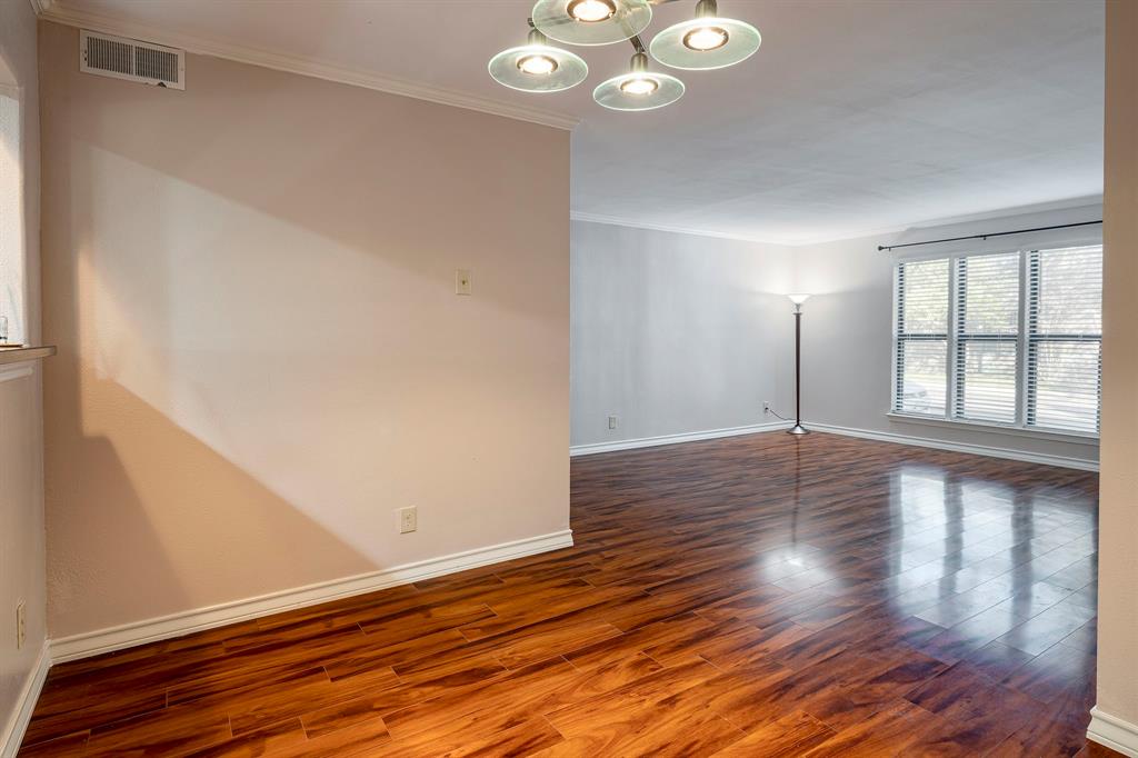 10757 Villager Road, Unit B Dallas, TX 75230 - Photo 9 of 36 Dining area with view of living room