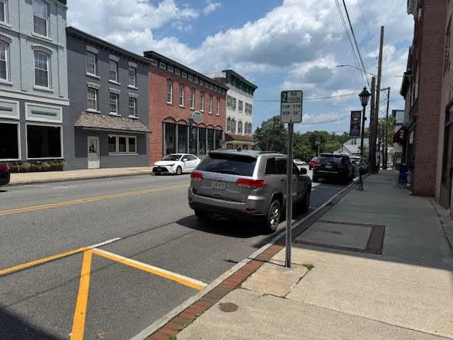 a view of a street with cars