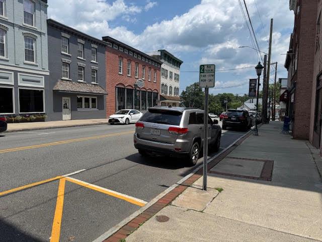 a view of a street with cars