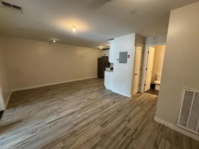 a kitchen with stainless steel appliances a refrigerator and a stove top oven