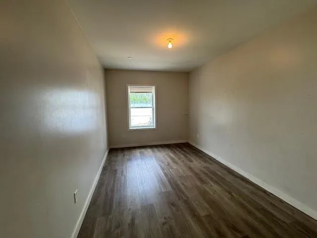 a bathroom with a shower and a sink