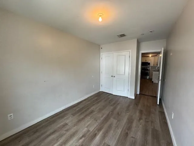 a bathroom with a sink mirror vanity and toilet