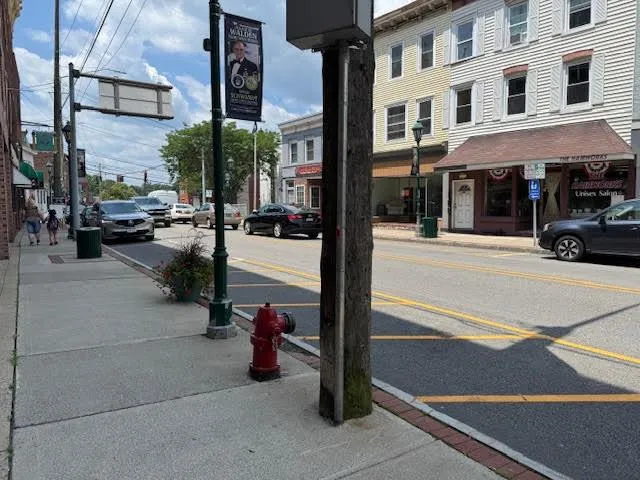a view of a street with cars