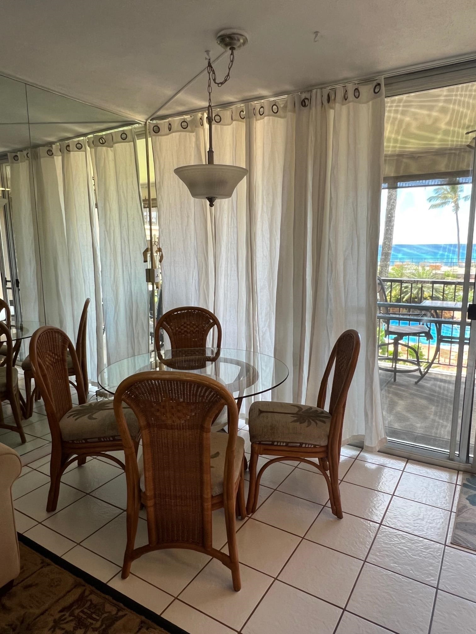 3823 Lower Honoapiilani Road, Unit 211 Lahaina, HI 96761 - Photo 11 of 34 a work room with furniture and a chandelier