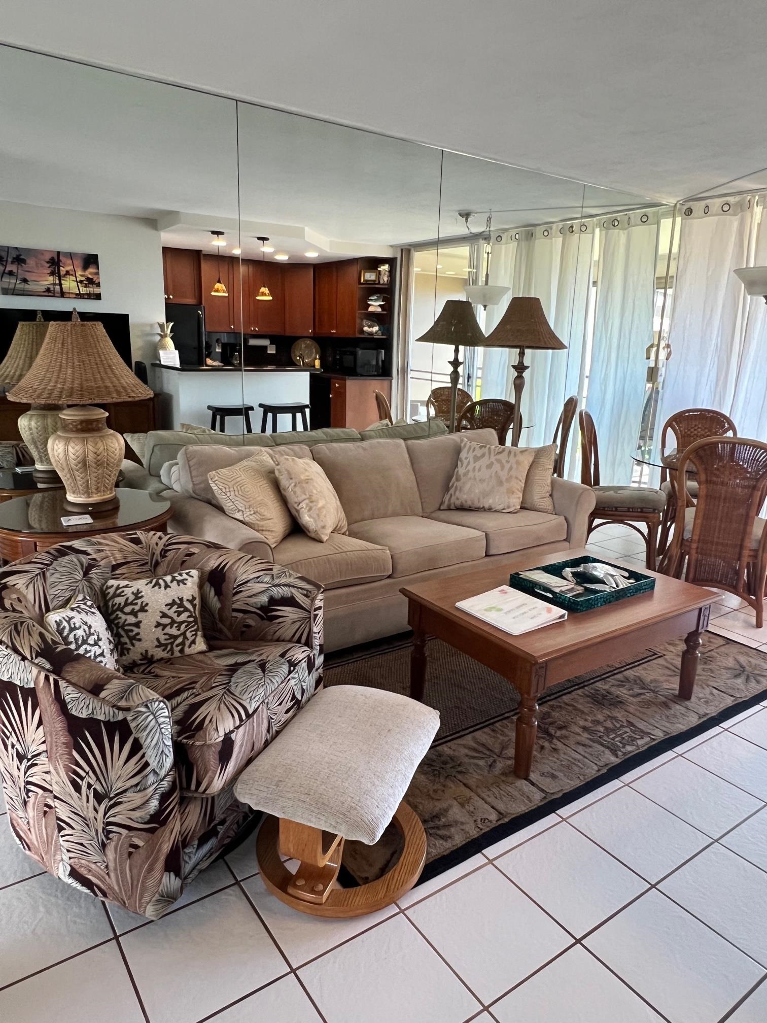 3823 Lower Honoapiilani Road, Unit 211 Lahaina, HI 96761 - Photo 13 of 34 a living room with furniture and a large window