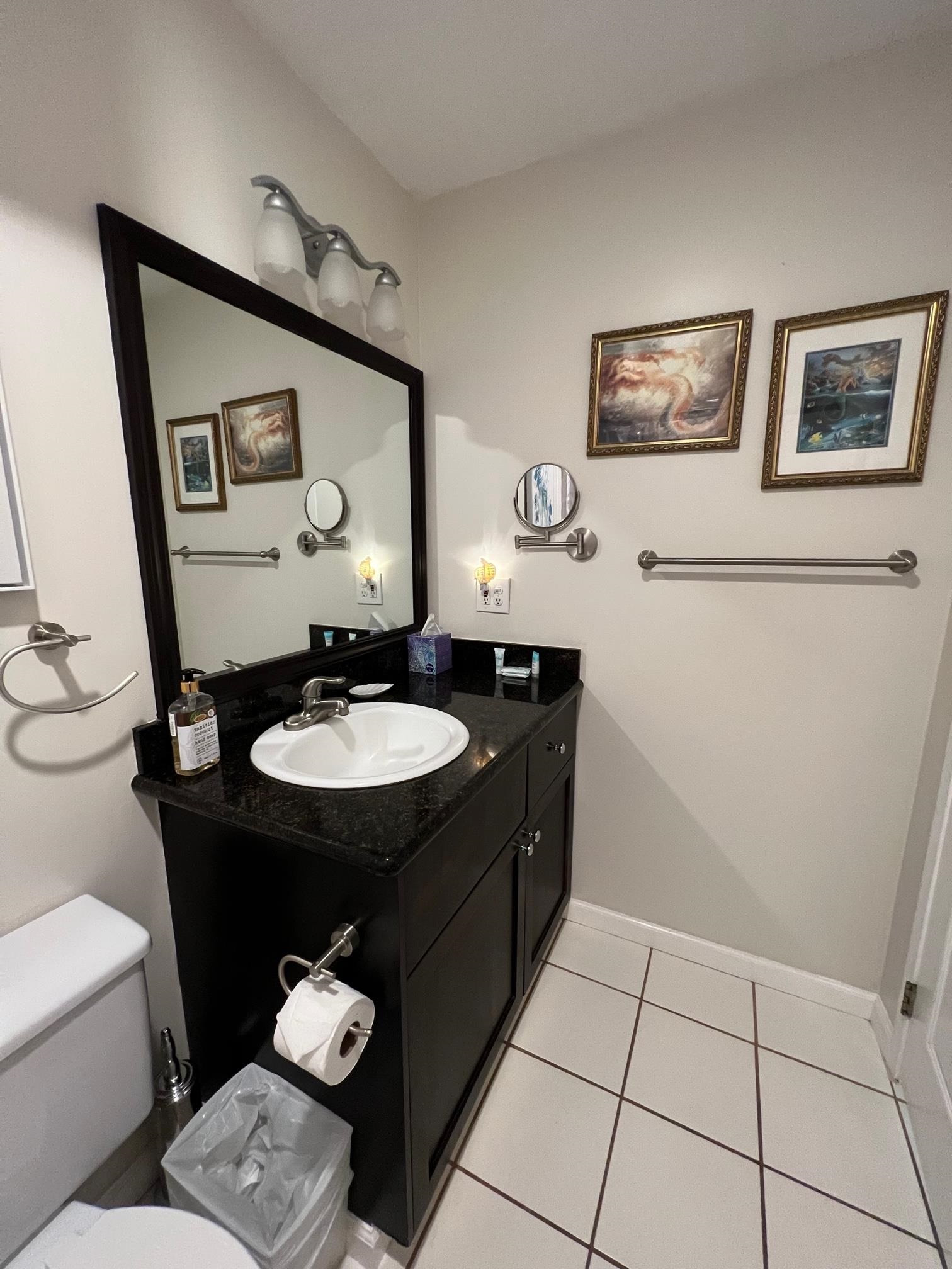 3823 Lower Honoapiilani Road, Unit 211 Lahaina, HI 96761 - Photo 14 of 34 a bathroom with a sink mirror and toilet