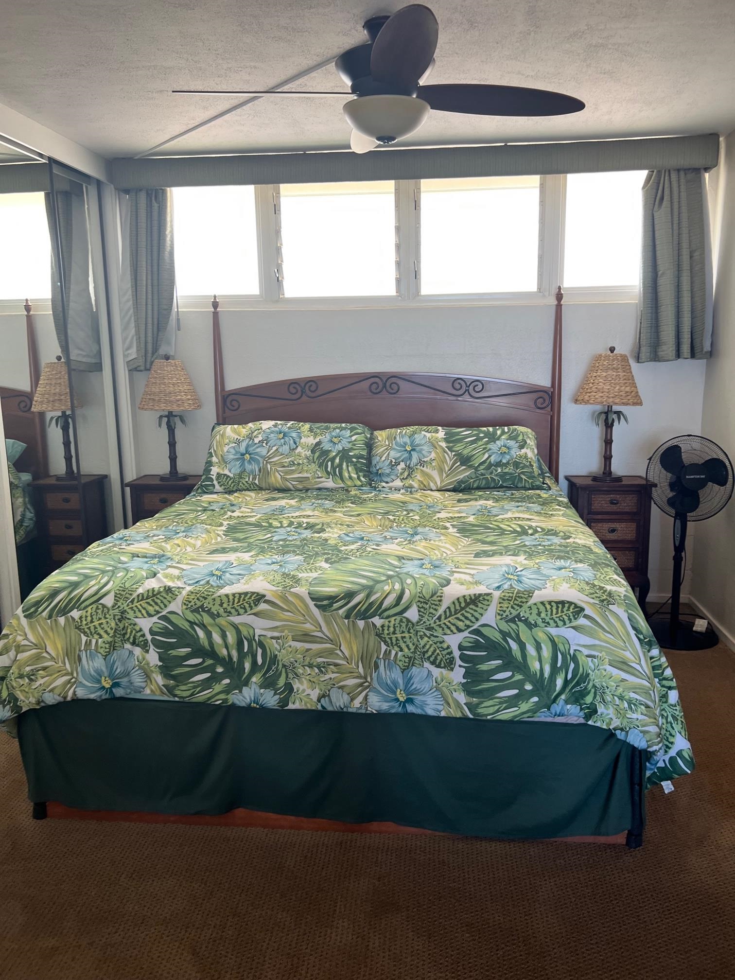 3823 Lower Honoapiilani Road, Unit 211 Lahaina, HI 96761 - Photo 16 of 34 a bed sitting in a bedroom next to a window