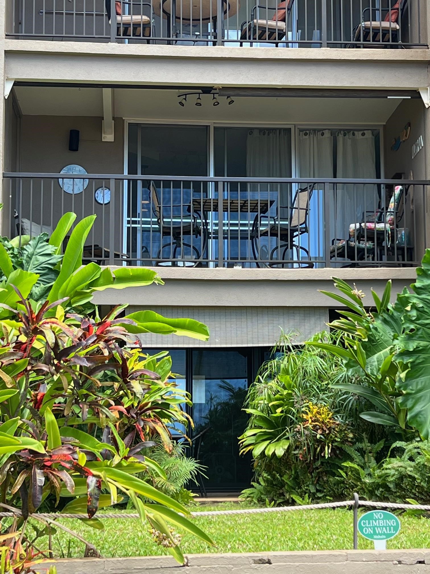 3823 Lower Honoapiilani Road, Unit 211 Lahaina, HI 96761 - Photo 20 of 34 a view of a house with a swimming pool and a yard