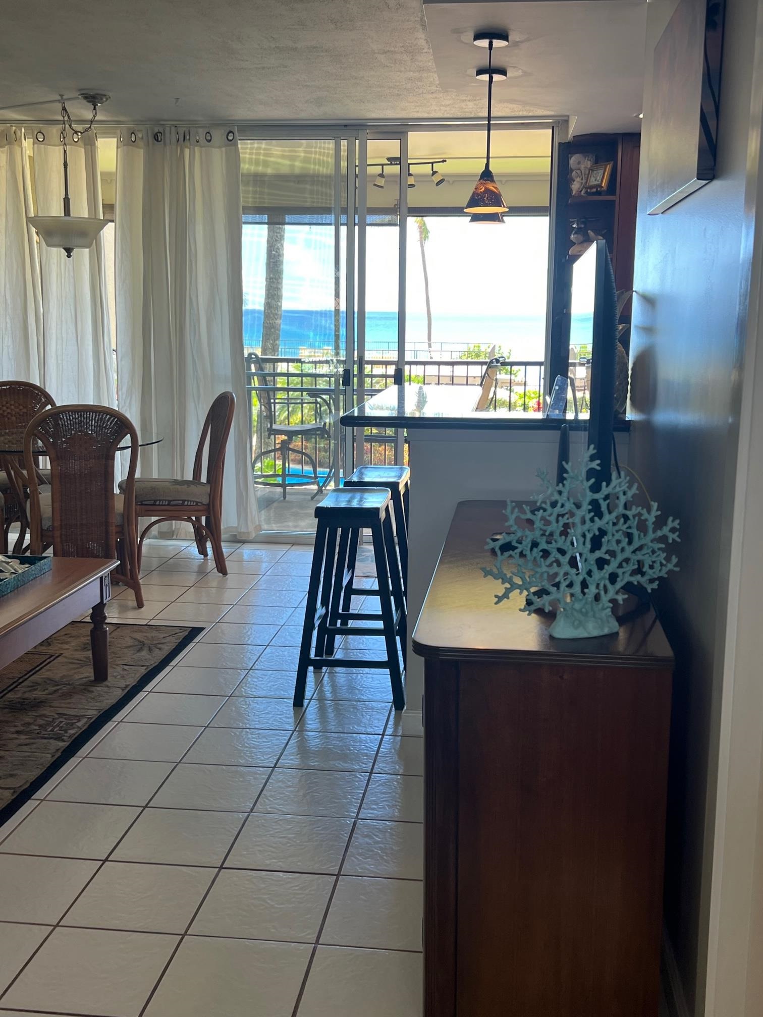3823 Lower Honoapiilani Road, Unit 211 Lahaina, HI 96761 - Photo 2 of 34 a dining room with furniture and window