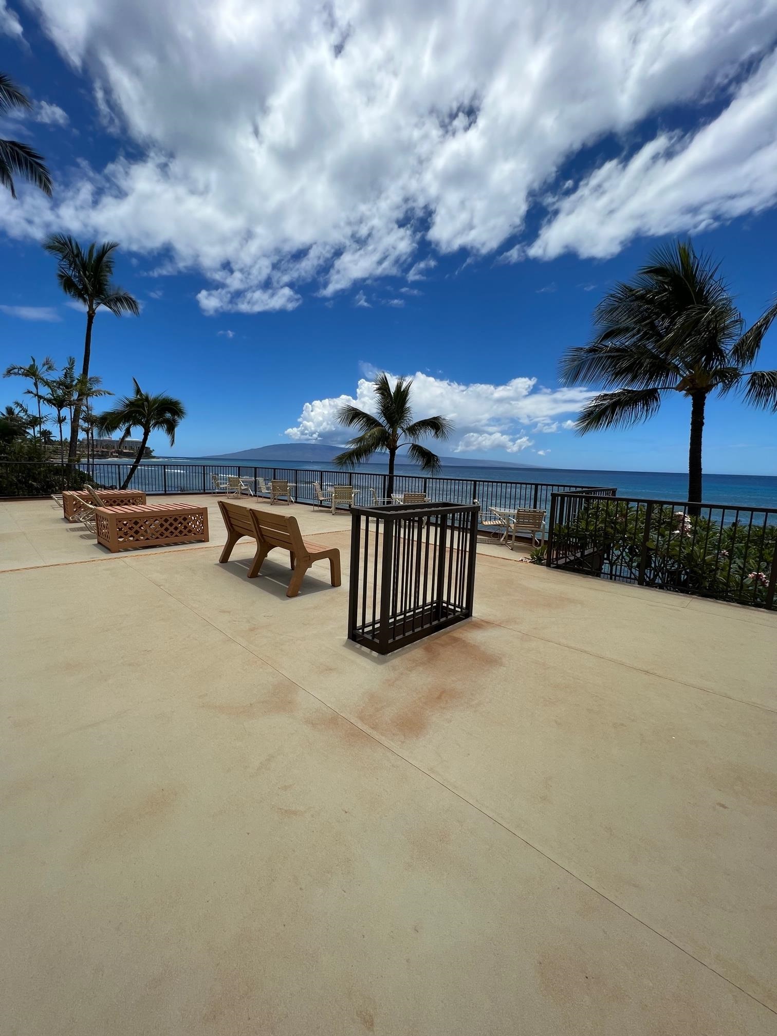 3823 Lower Honoapiilani Road, Unit 211 Lahaina, HI 96761 - Photo 28 of 34 a view of a barbeque with wooden stairs and a bench