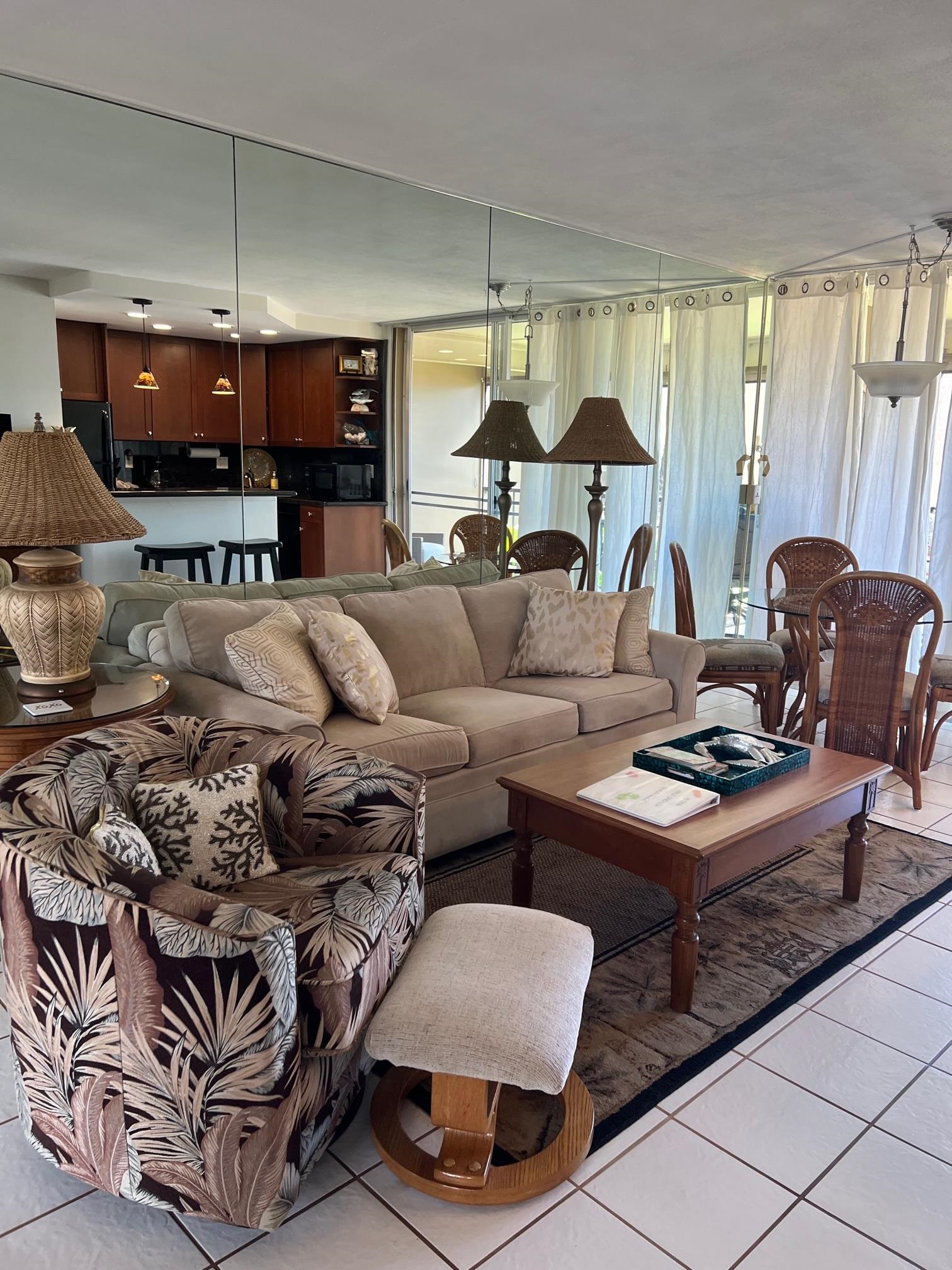 3823 Lower Honoapiilani Road, Unit 211 Lahaina, HI 96761 - Photo 5 of 34 a living room with furniture and a flat screen tv
