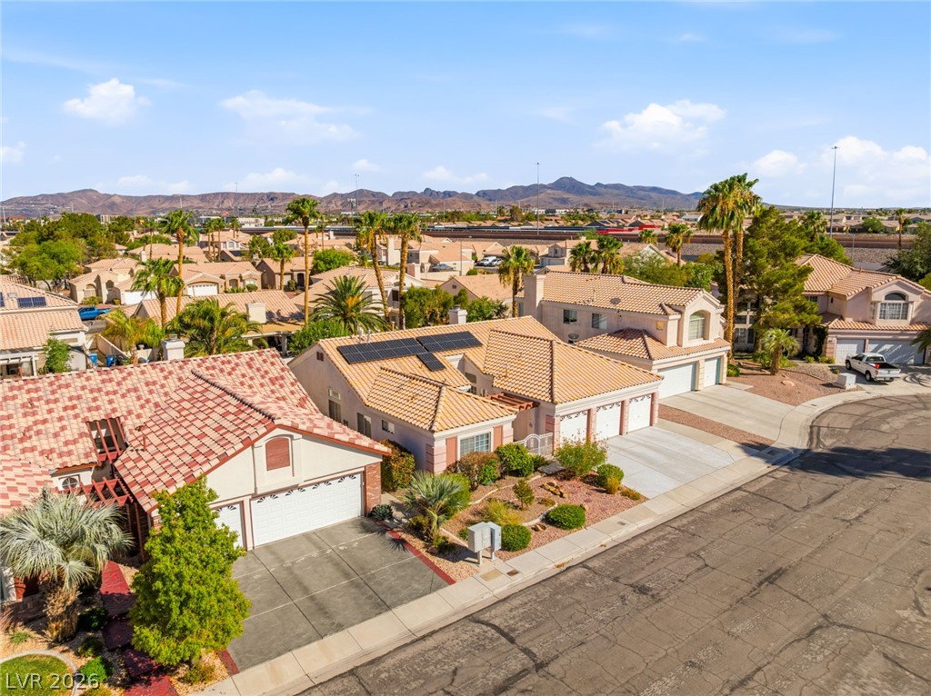 9034 Ridgepointe Way Henderson, NV 89074 - Photo 46 of 56 Tiled rooftops and clean driveways define this quiet suburban neighborhood with mountain backdrops.
