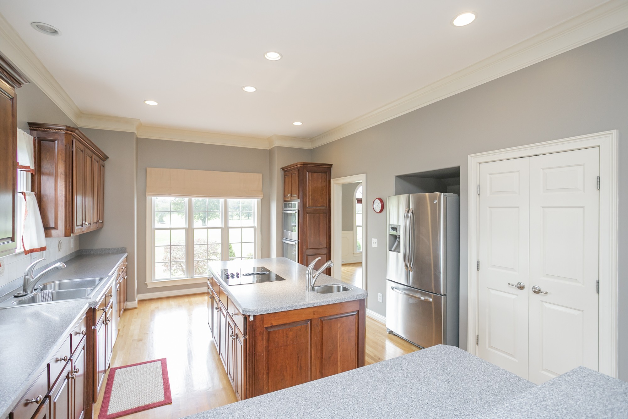 184 Rock Bridge Road Gallatin, TN 37066 - Photo 10 of 50 a kitchen with stainless steel appliances granite countertop a sink stove and refrigerator
