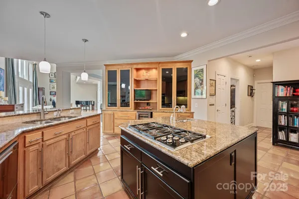 a kitchen with a stove and a sink
