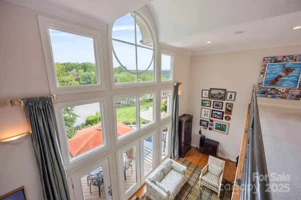 a view of an entryway with wooden floor and windows