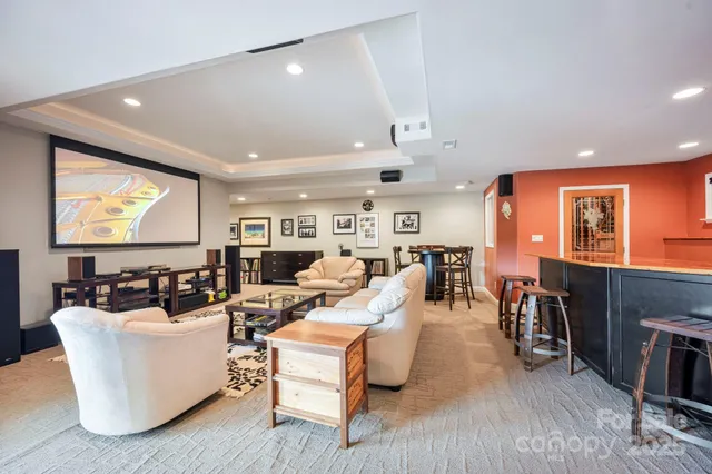 a living room with fireplace furniture and a flat screen tv