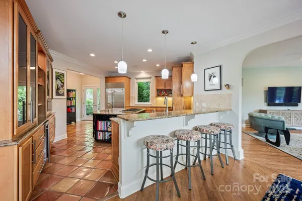 a view of a dining room kitchen with furniture and a kitchen