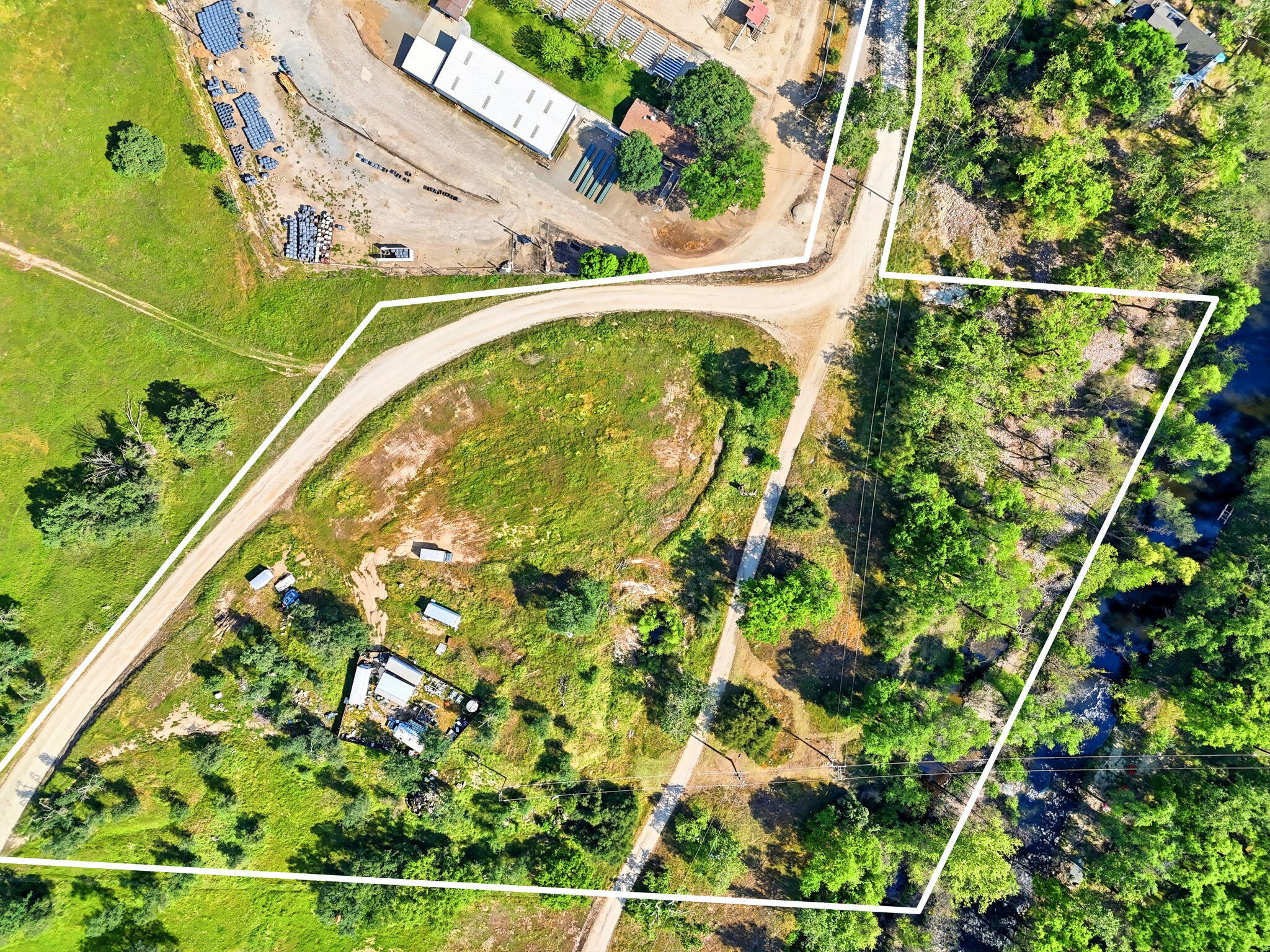 Three North Kaweah River Drive Three Rivers, CA 93271 - Photo 5 of 22 property line should go to the middle of the river and the inner edge of the road. Buyer to verify.