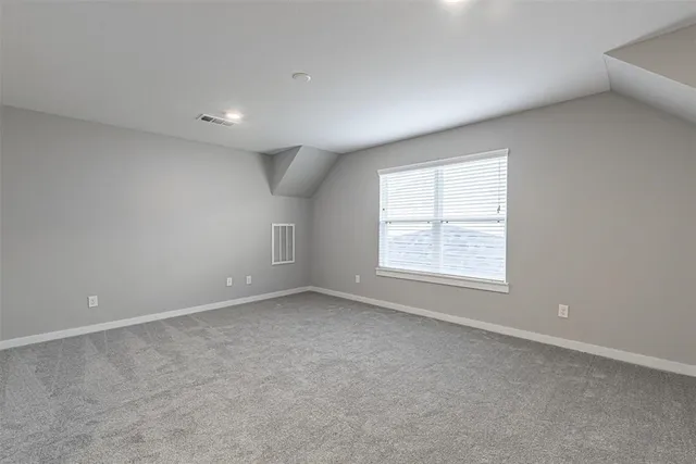 a view of a backyard with wooden fence