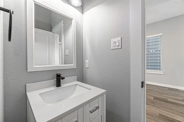 a bathroom with a sink and a mirror