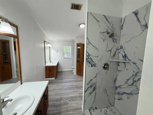 a bathroom with a sink and mirror