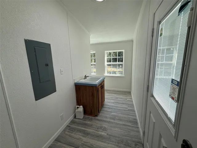 a view of a kitchen from the hallway