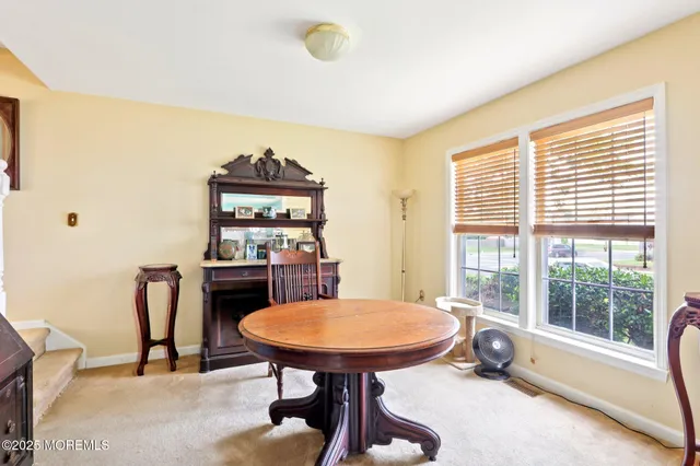 a view of a dining room with furniture window and outside view