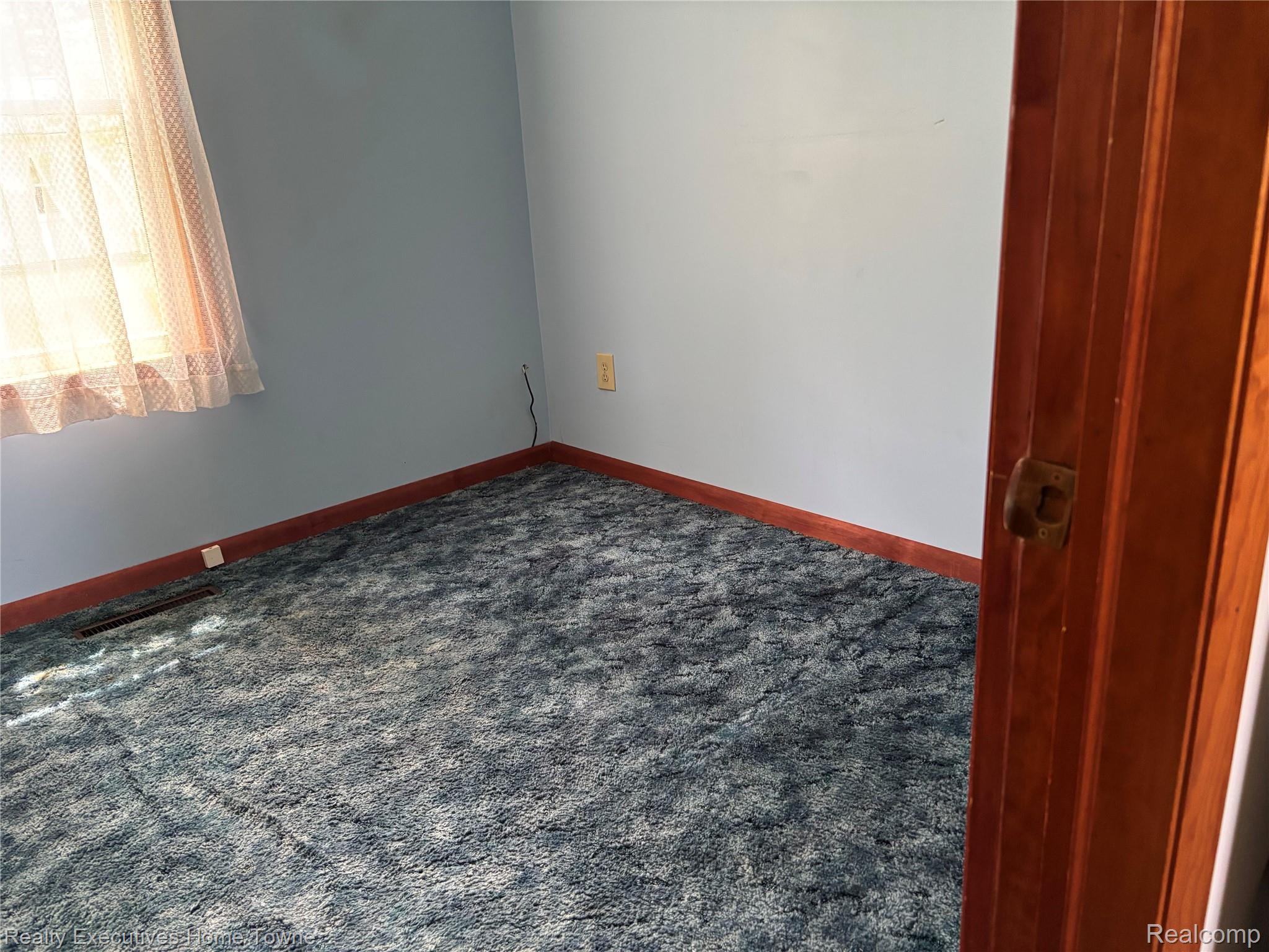 1782 Maple Road Smiths Creek, MI 48074 - Photo 19 of 30 2nd bedroom featuring dark carpet and baseboards