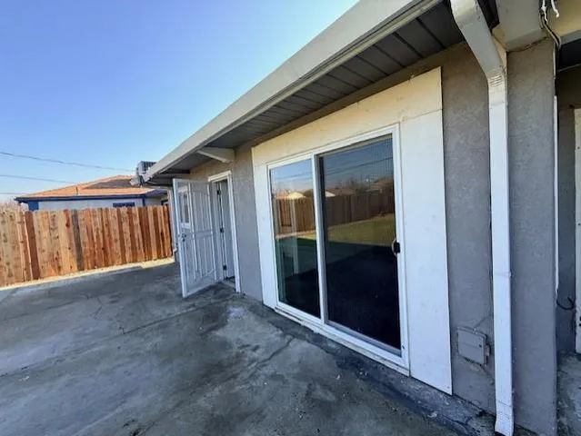 a view of front door and wooden floor