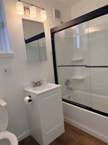 a bathroom with a toilet and a sink