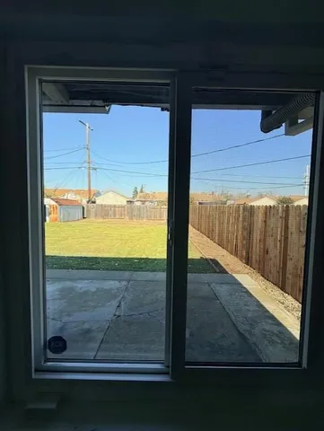 a room with wooden floor and a sink