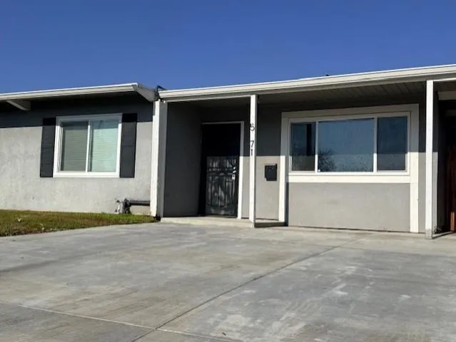 a front view of a house with a garage