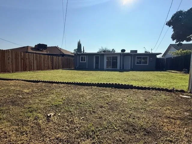 a view of backyard with porch