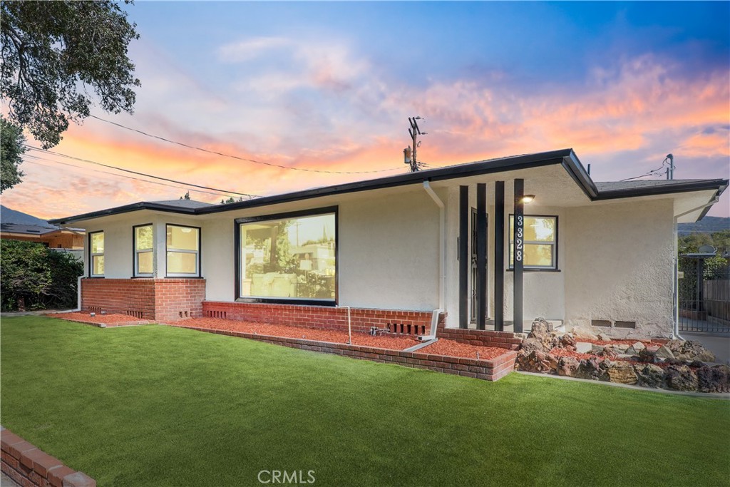 3328 North Verdugo Road Glendale, CA 91208 - Photo 1 of 42 a front view of a house with a garden and yard