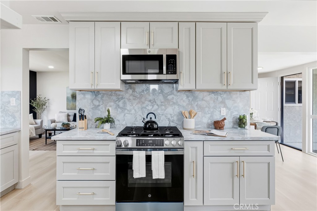 3328 North Verdugo Road Glendale, CA 91208 - Photo 15 of 42 a kitchen with white cabinets and appliances