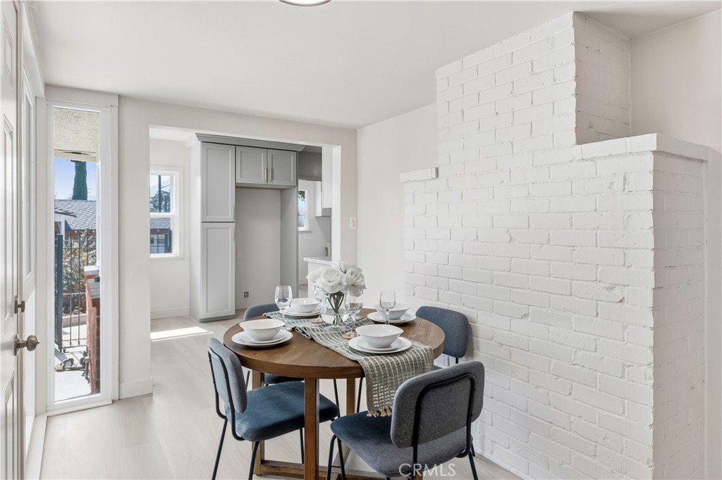 3328 North Verdugo Road Glendale, CA 91208 - Photo 16 of 42 a view of a dining room with furniture and wooden floor