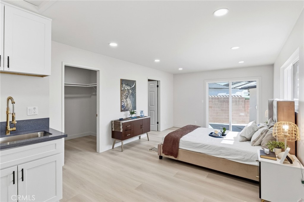 3328 North Verdugo Road Glendale, CA 91208 - Photo 21 of 42 a bedroom with a bed and wooden floor